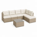 Set salon d'extérieur 7 pièces en résine tressée PE tourterelle avec coussins beige, table basse et pouf, 260 × 200 × 64 cm